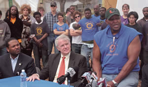 ashanti-hamilton-and-Mayor-Tom-Barrett-listen-as-Growing-power-Will-Allen-announces-new-grant-allowing-for-150-jobs-focused-on-black-males