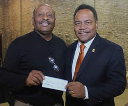 Spencer-Coggs-presenting-donation-Clay-Benson-Wisconsin-Black-Historical-Museum