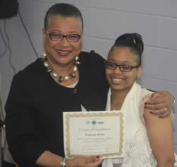 Marie-Johns-congratulates-graduate-Jewrena-Sims