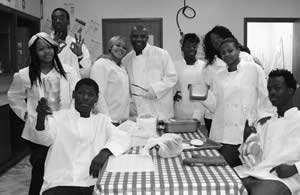 Students-complete-project-prepared-catered-served-lunch-for-Ceria-M-Travis-Academy-Executive Office-Travis-Vocational-High-School-staff
