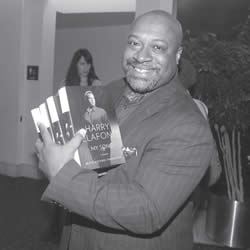 Dr. Robert (Bert) Davis, president & CEO of the Zoological Society of Milwaukee was one of the attendees for the YWCA’s annual event, ‘Promoting Racial Justice’. He was so inspired by Belafonte’s address that he made sure he purchased several of his books. (Photo by Robert A. Bell)