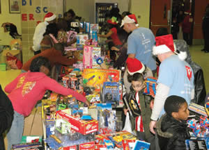 Hundreds of children received gifts and toys during the CYD event held on Friday, Dec. 27, 2013 at the North Division High School Campus. (Photo by Cy White)