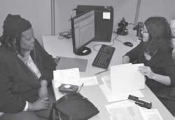 Ruth Winston of Milwaukee is helped by Susana Azcueta with her taxes at SDC Richards Street.