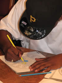 A young man works on a project during an Art Therapy class at SDC