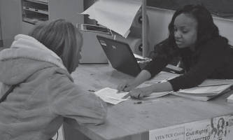 Tanesa Taylor has her taxes prepared at Integrated Mobile Monday held by SDC at the COA Goldin Center.