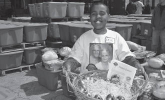 1,500 area families received Easter meals this week from Palermos and The Hunger Task Force’s annual event to help needy families.Pictured above is one of the Palermo’s volunteers. He’s holding a basket of 50 golden Easter eggs, which each contained a $50 bill. These 50 eggs were distributed to 50 Easter basket recipients at random as an extra holiday gift in commemoration of Palermo’s 50th anniversary this year.