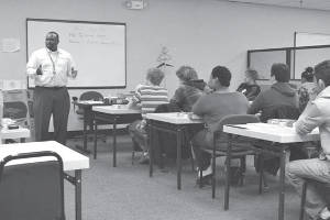Instructor Terrence Moore explains the ACT test to high school students taking part in the free ACT Wings Workshop at SDC.
