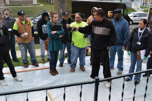 Lead abatement contractors explain what they did during a safety exercise at a lead safety workshop