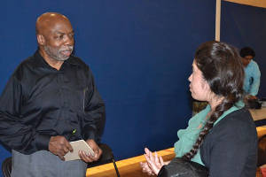 SDC Commissioner Dr. Gary Williams discusses youth and poverty with Rebecca Arcos following a public forum at Journey House