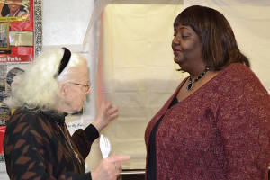 SDC Commissioner Stephanie Findley talks with a resident prior to the Community Brainstorming Forum