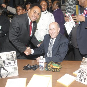 12-5-09-jim-doyle-spencer-coggs-juneteenth-day State Senator Spencer Coggs is congratulated by Governor Jim Doyle for his work on getting the Juneteenth Day legislation passed. (Photo by Robert A. Bell)