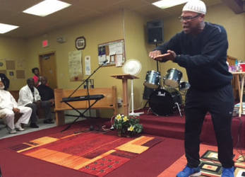 Spoken word artist Muhibb Dyer giving an impromptu performance at a memorial service for Taki S. Raton.