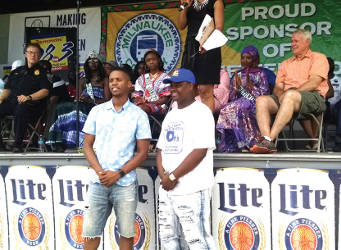 (Left to right) Nicholas Stokes, MKE fellows graduate of Morehouse College and Kalan Haywood of the Milwaukee Youth Council, president of Youth Council are honored at Juneteenth. (Photo by Mrinal Gokhale).