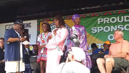 Three Juneteenth contestants are all smiles when they’re each given a check. (Photo by Mrinal Gokhale).