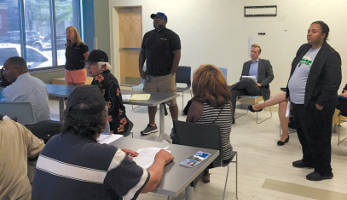 Ald. Milele Coggs held a neighborhood meeting Monday July 23, to receive community input on the city’s potential building sale to Right Step Inc. (Photo by Dylan Deprey)