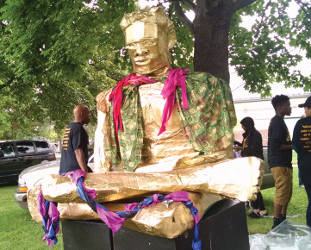 Express Yourself Milwaukee displays their “Golden Boy,” created by local youth from juvenile detention centers (Photo by Mrinal Gokhale)