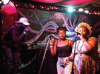 Klassik, Kyndal J, and B Free handle vocals during the “Coronation” release party. (Photo by Dylan Deprey)