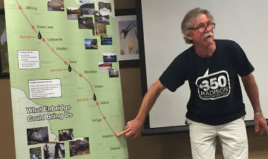 Harry Bennett traces the route Line 61 takes, and the additional pump stations to be included in the upcoming expansion. (Photo by Dylan Deprey)