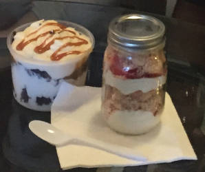 Classy Lil’ Cheesecake fudge caramel brownie and strawberry crunch cheesecake in a jar. (Photo by Karen Stokes)
